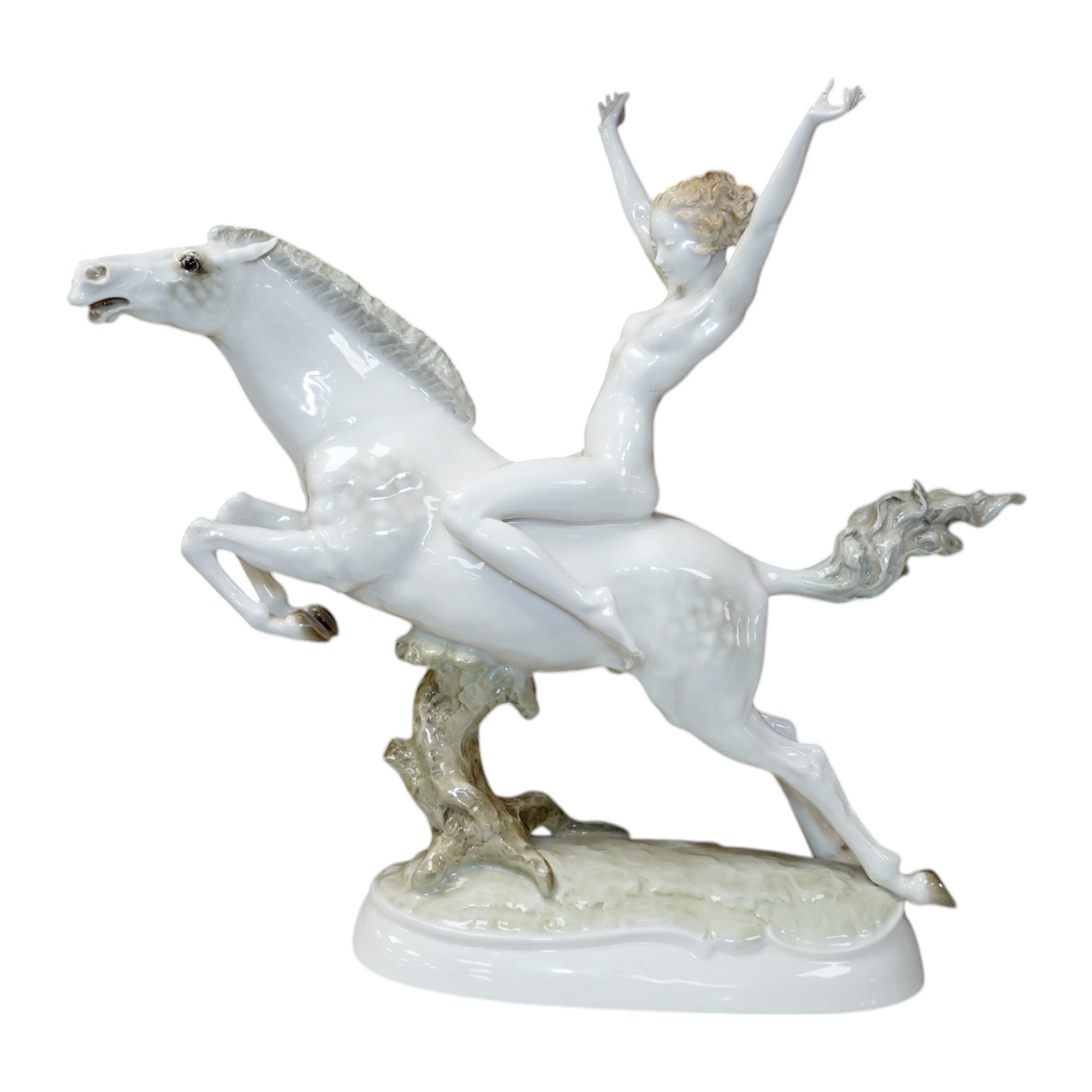 An Art Deco Hutschenreuther female nude rider on horseback, 32cm high. Condition - thumb of rider cracked